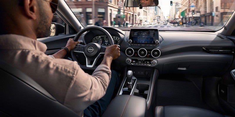 A person driving a 2023 Nissan Sentra
