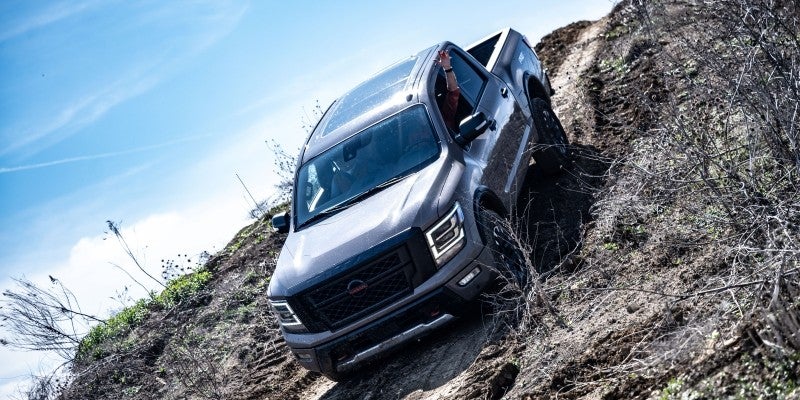 2023 Nissan Titan descending a hill