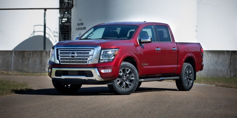 2023 Nissan Titan parked next to a building