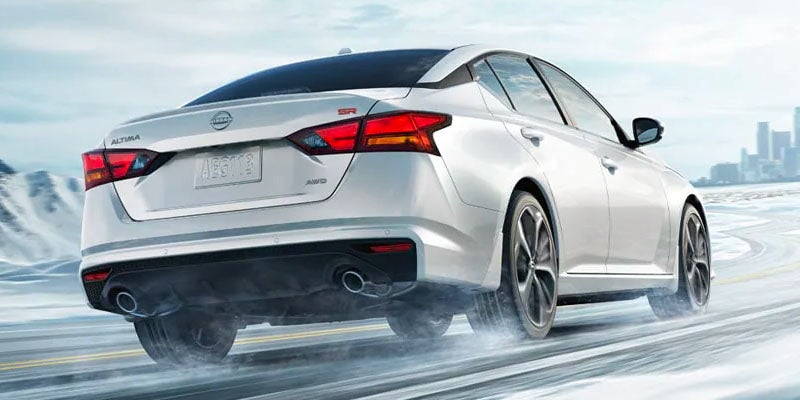 2025 Nissan Altima parked next to a building