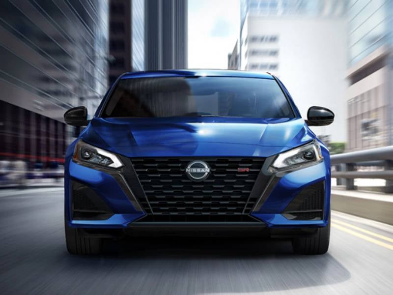 Paul Miller Nissan in Fairfield CT 2023 Nissan Altima in blue driving in a city